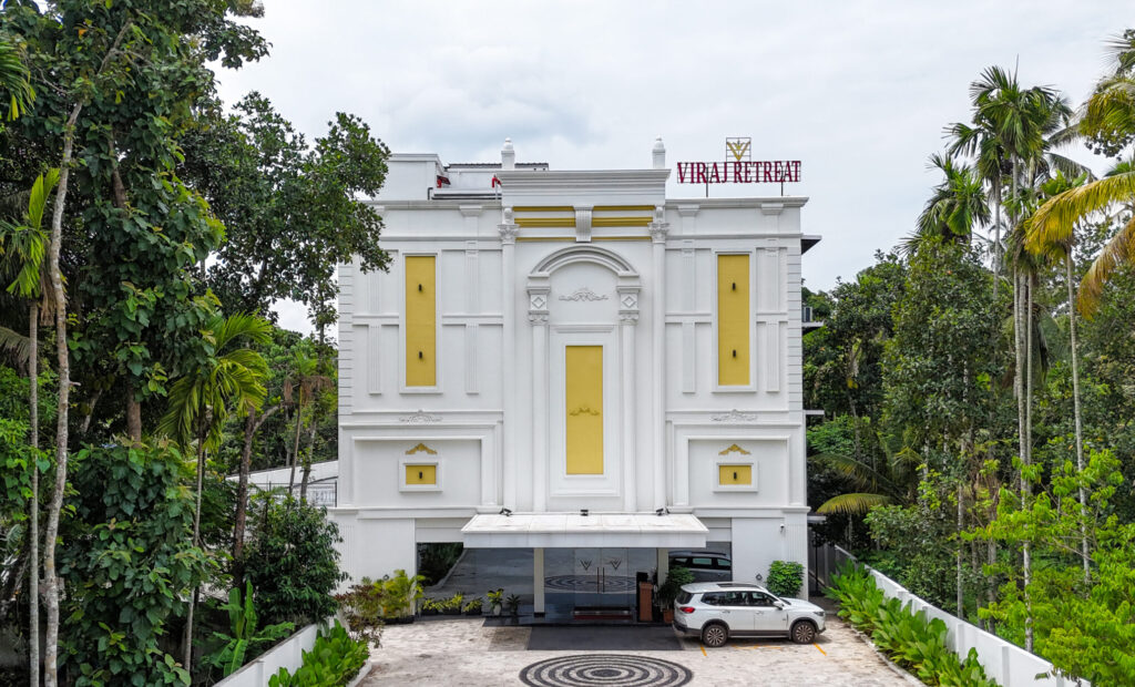 Front view of Hotel Viraj Retreat with greenery and peaceful surroundings-Best Hotel in munroe island